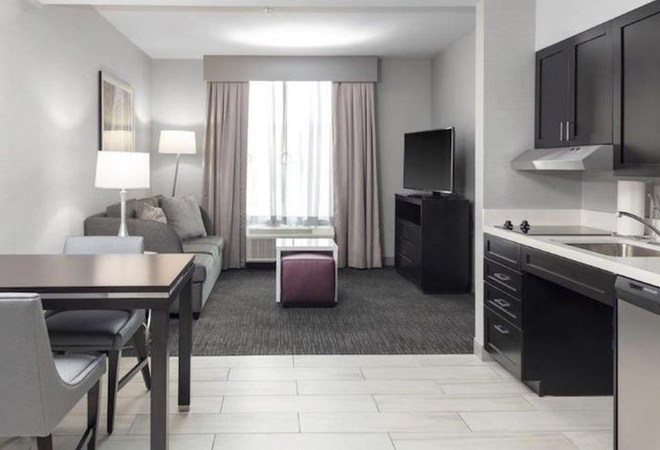 An extended stay hotel room with a kitchen at the Homewood Suites by Hilton in Largo .