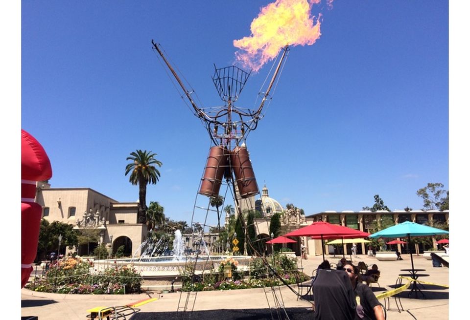 This Mini Burning Man, created by Brock Ritchey (seated in forefront, and welder Wylie Weldy, is going to Burning Man later this month.
