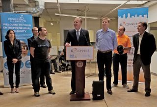 Mayor Faulconer (center) announcing highlights of the 2016 CONNECT Innovation Report surrounded by local entrepreneurs. Left to right are Abreos Biosciences chief scientists Dr. Dina Uzri, Benefunder managing director Tom Paparatto, DeskHub president/CEO Jay Chernikoff, 
Mayor Faulconer. CONNECT president/CEO Greg McKee, Chalk Digital founder/CEO Craig Hagopian, and Portable Genomics CEO Patrick Merel.
