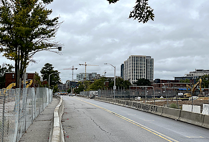 Demolition work on Perkins Homes continued in early October 2022. Looking to the south l along South Caroline Street cranes are at work on the Harbor East skyline. 