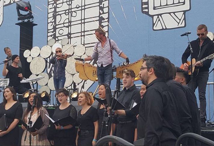 Earth Harp Collective and Sacra Profana Choir performing at Horton Plaza Park reopening celebration.