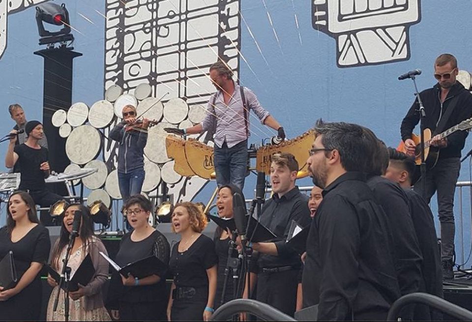 Earth Harp Collective and Sacra Profana Choir performing at Horton Plaza Park reopening celebration.