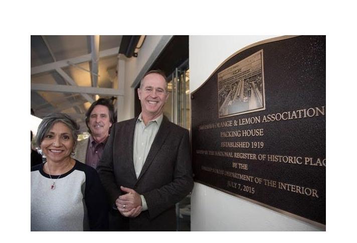 (L-R) Anaheim Community Investment Manager Laura Alcala, Community and Economic Development Director John Woodhead, and Mayor Tom Tait pose with The Packing House Placard.