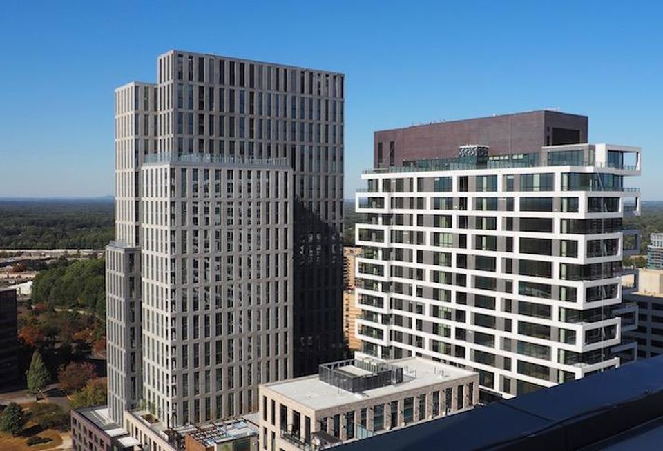 The high-rise apartment and condo towers that delivered at The Boro in Tysons in late 2019.