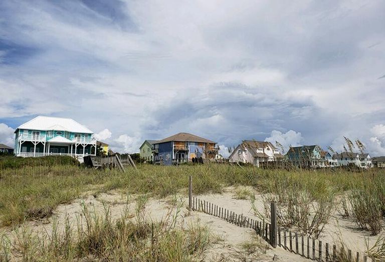 At Emerald Isle, some houses were boarded up while others were not.