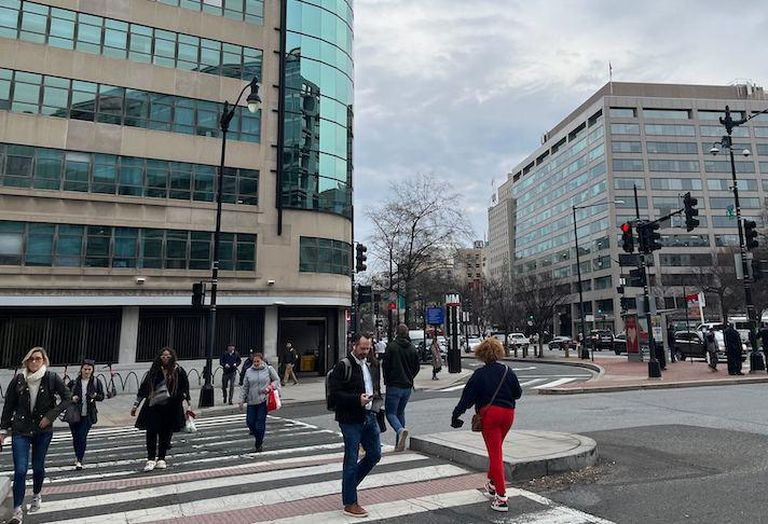 Pedestrians crossing Connecticut Avenue in Downtown D.C. during the morning commute on Feb. 9, 2022. 