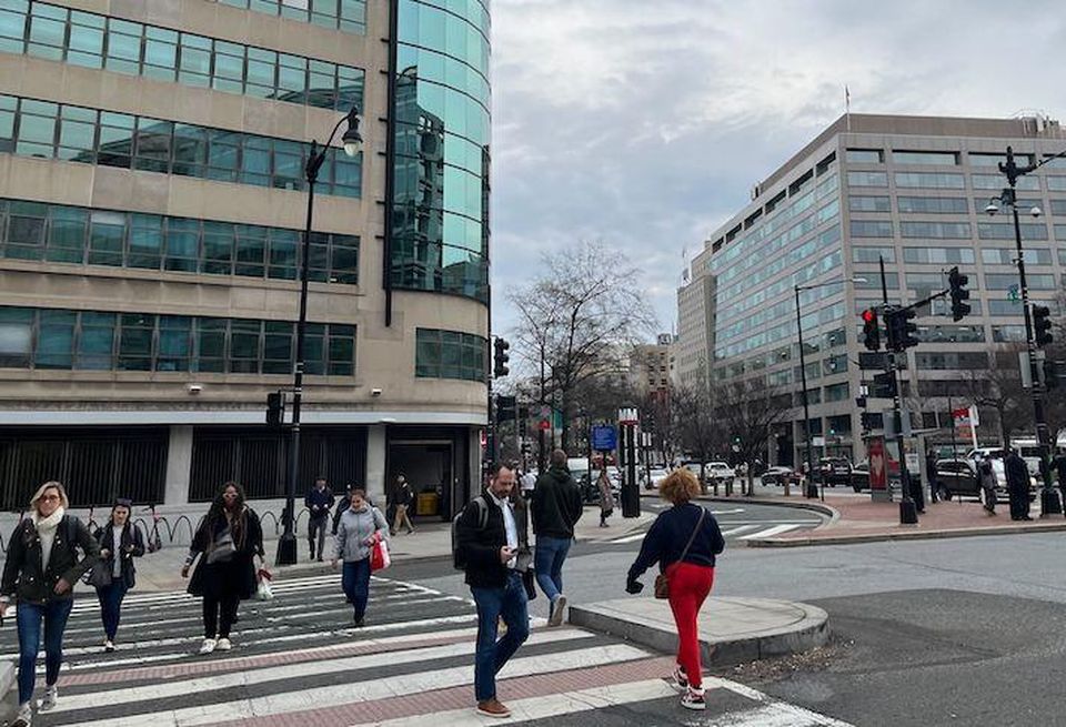 Pedestrians crossing Connecticut Avenue in Downtown D.C. during the morning commute on Feb. 9, 2022.