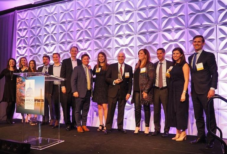 The JBG Smith team accepting the Deal of the Decade award for landing Amazon HQ2