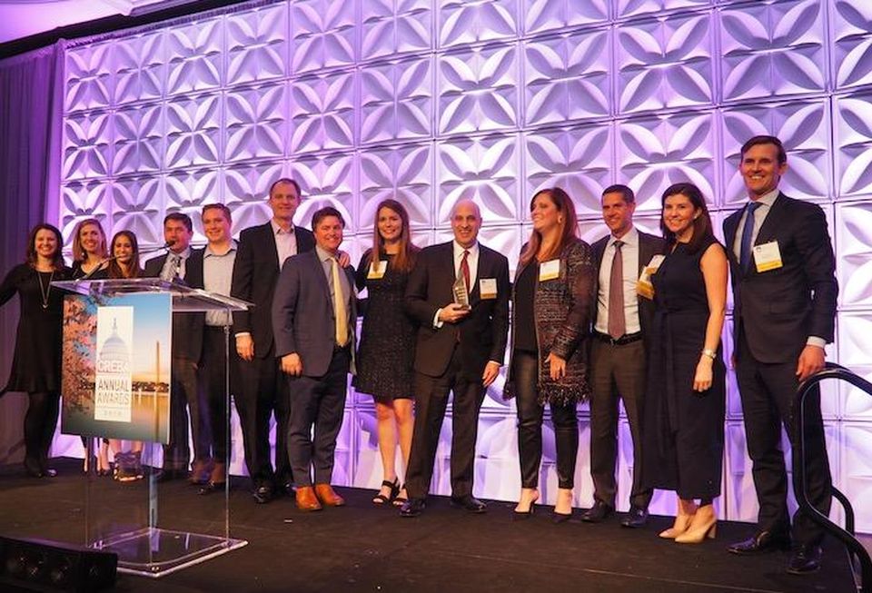 The JBG Smith team accepting the Deal of the Decade award for landing Amazon HQ2