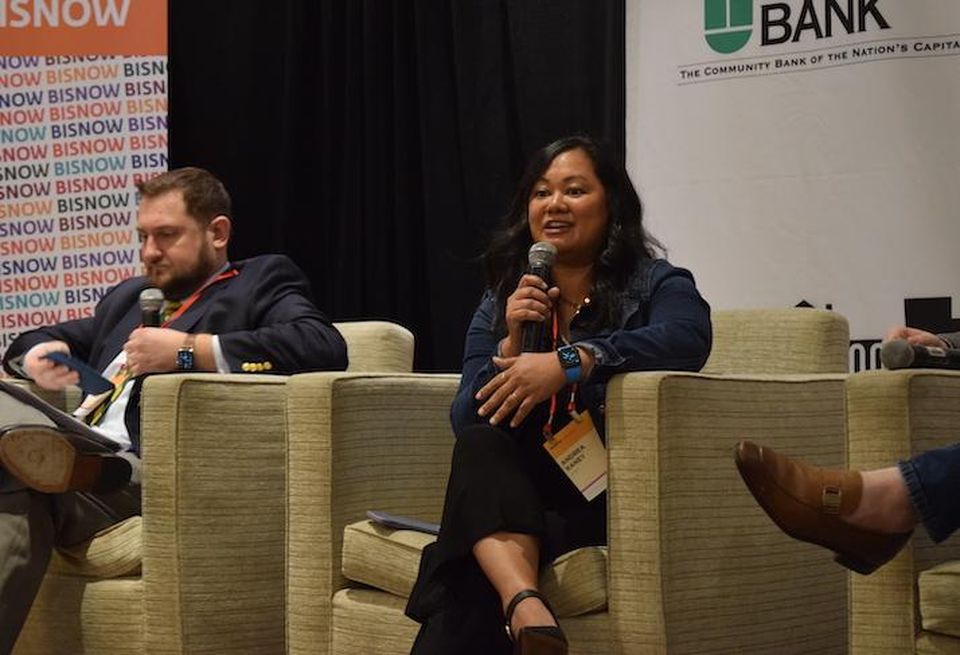 Walsh Colucci Lubeley & Walsh's Nick Cumings and AT&T's Andrea Raney speaking at Bisnow's National Landing Update event.