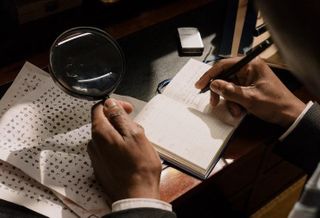 scrutiny documents investigation magnifying glass
