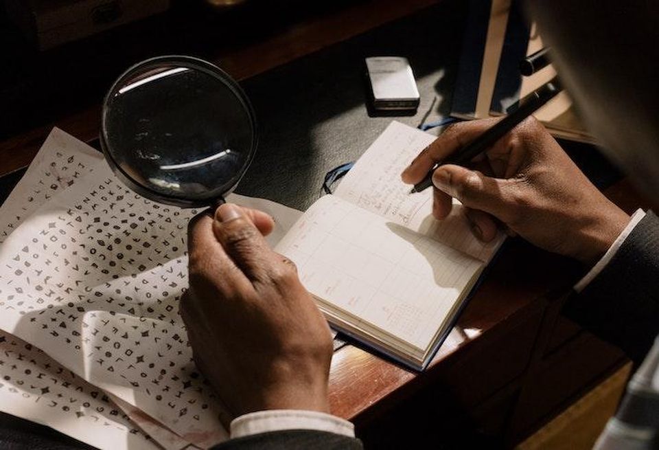 scrutiny documents investigation magnifying glass