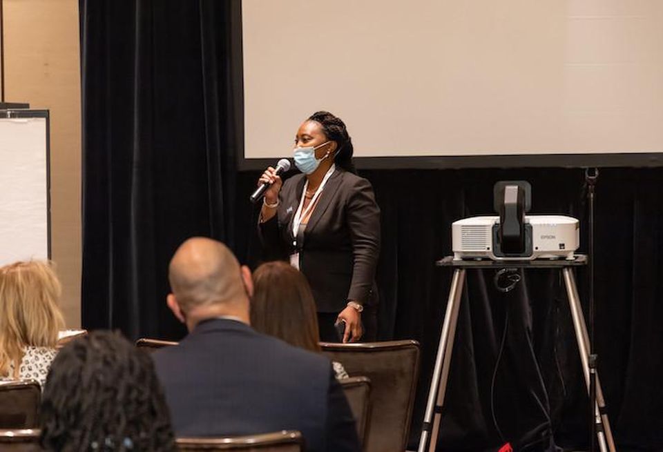 Melan Property Management founder Byrdy Kelley speaking at the 2021 IREM summit in Las Vegas.