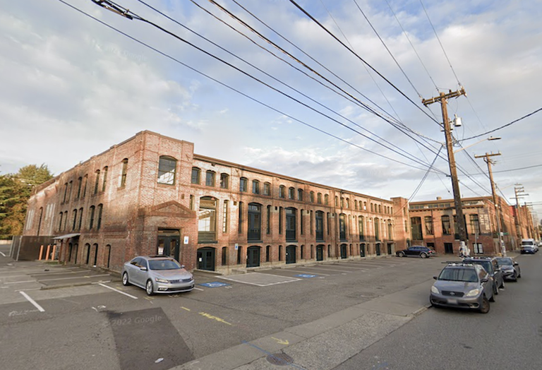 The office building converted from a former bottling plant where KBC maintains its Seattle office. 