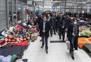 A delegation including U.S. Secretary of State Antony Blinken and Polish Foreign Minister Zbigniew Rau visiting a Ukrainian refugee reception center in Poland on March 5. 