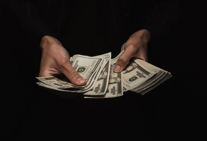 cash money hand counting dollar bills