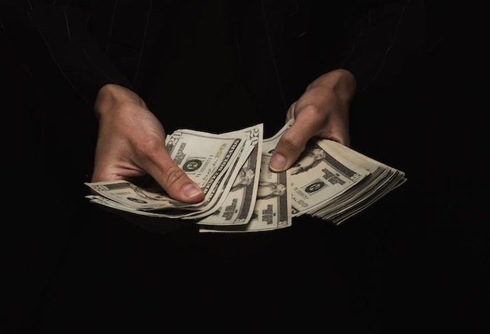 cash money hand counting dollar bills