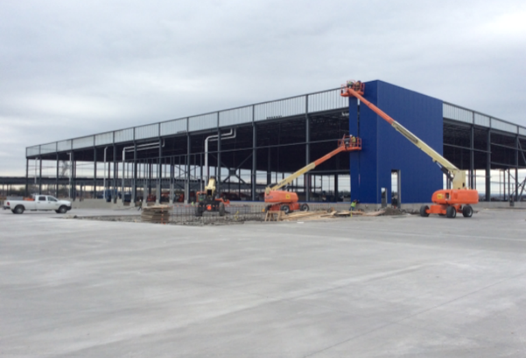 Steel framing has progressed enough that installation of iconic blue panels has begun on the future Grand Prairie IKEA store set to open this fall. Construction by MYCON Construction
