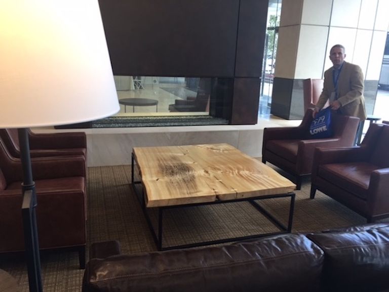 The lobby at Colorado Center Tower 3 has inviting seating areas and a large conference table