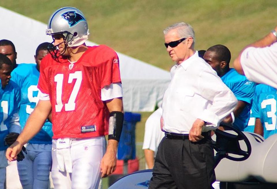 Jerry Richardson, right, walks with Jake Delhomme during Carolina Panther's Training Camp at Wofford College in Spartanburg, S.C., in 2009.