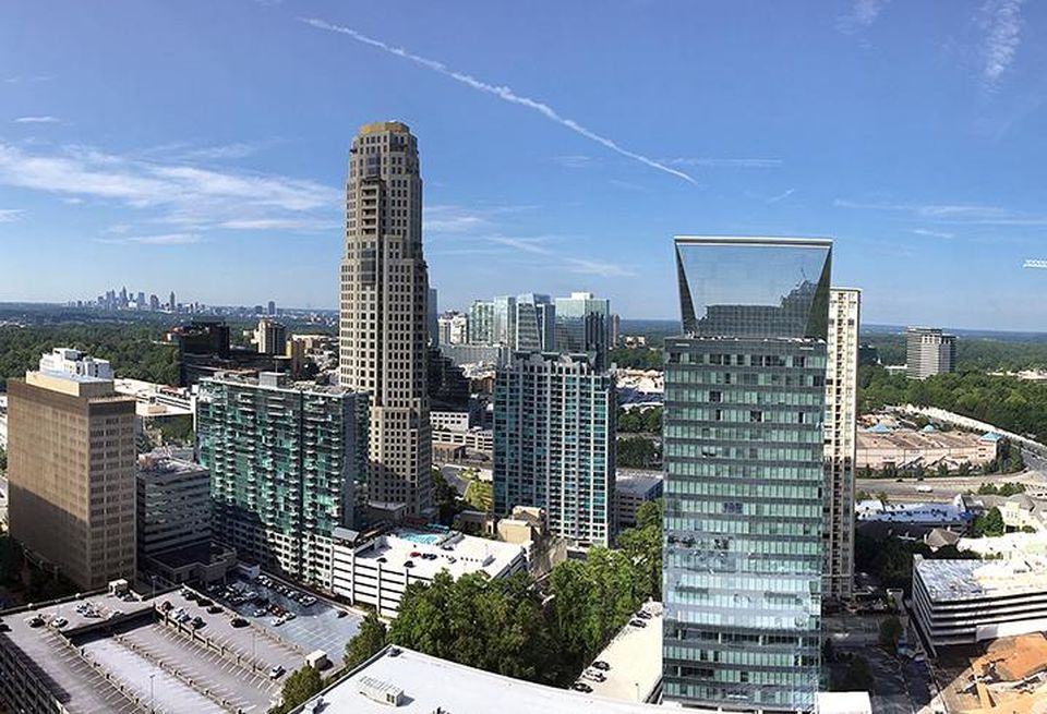 The view from the NKF Atlanta office, with the Buckhead skyline in the foreground and the downtown skyline in the background