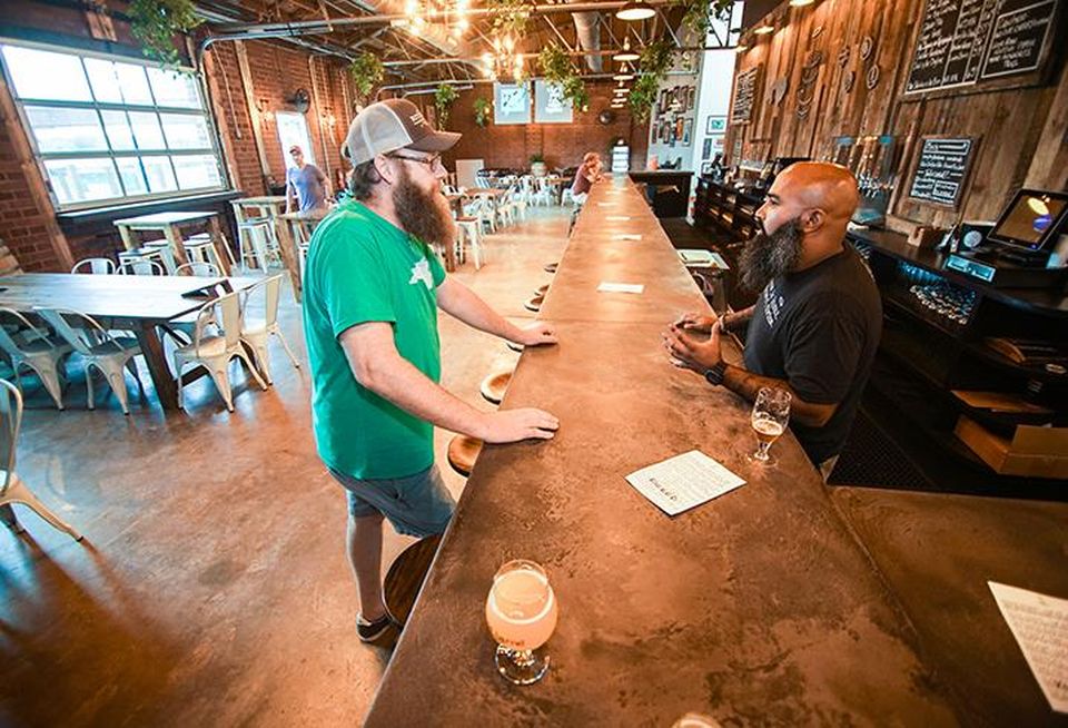 Divine Barrel Brewing owner Ben Dolphens and bartender Andrew Woods