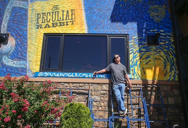 The Peculiar Rabbit owner Rob Nixon has a mural on the side of his restaurant created by Southern Tiger Collective. It serves as a way to work around the City of Charlotte's sign ordinance.