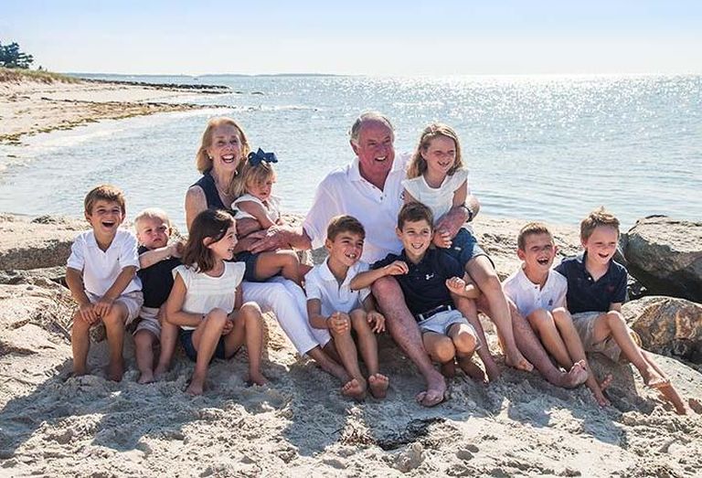 Colliers International, Boston Co-Chair Kevin Phelan with one of his daughters and all of his grandchildren
