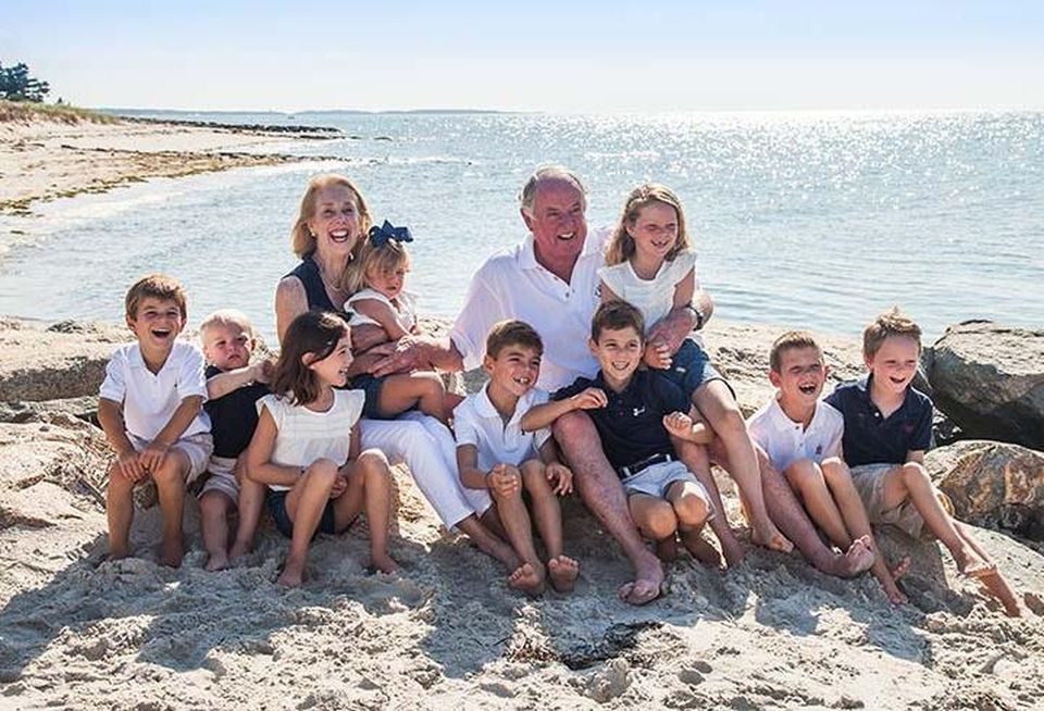 Colliers International, Boston Co-Chair Kevin Phelan with one of his daughters and all of his grandchildren