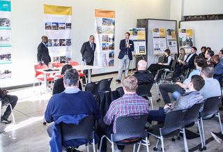 Charlotte City Planning Director Taiwo Jaiyeoba, visiting planning expert Mitchell Silver and Crescent Communities President of Commercial and Mixed Use Brian Leary speak to community members at a Unified Development Ordinance meeting.  
