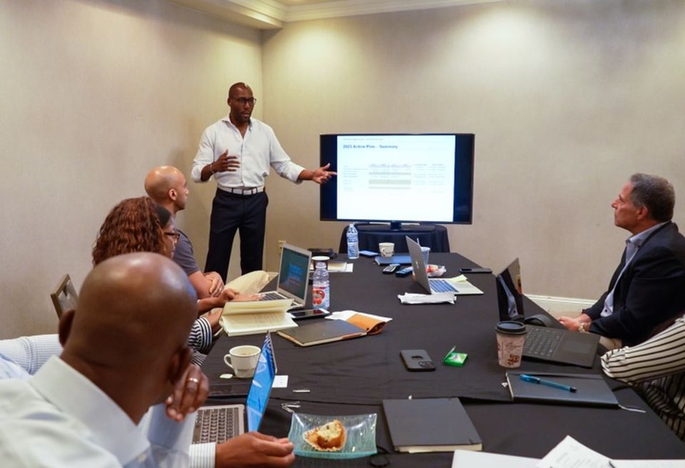 Tawan Davis (standing) at an Steinbridge Group executive meeting.
