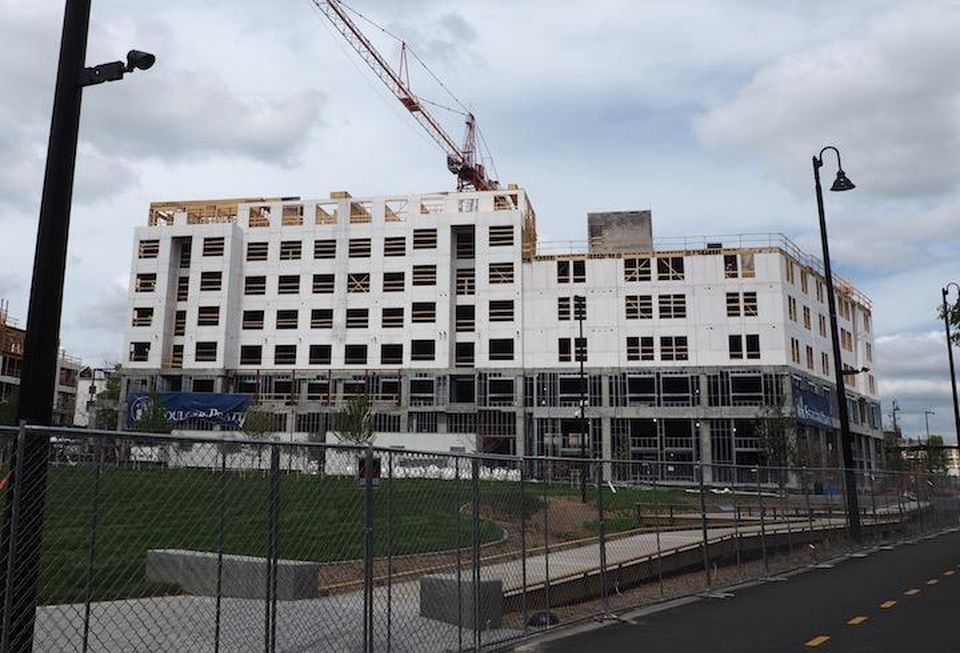 The Eckington Park development next to the fenced-off Tanner Park along the Metropolitan Branch Trail.