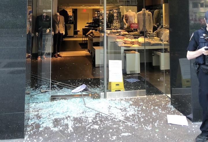 The front door of D.C.'s Men's Wearhouse was smashed in as the store was looted May 31, 2020.