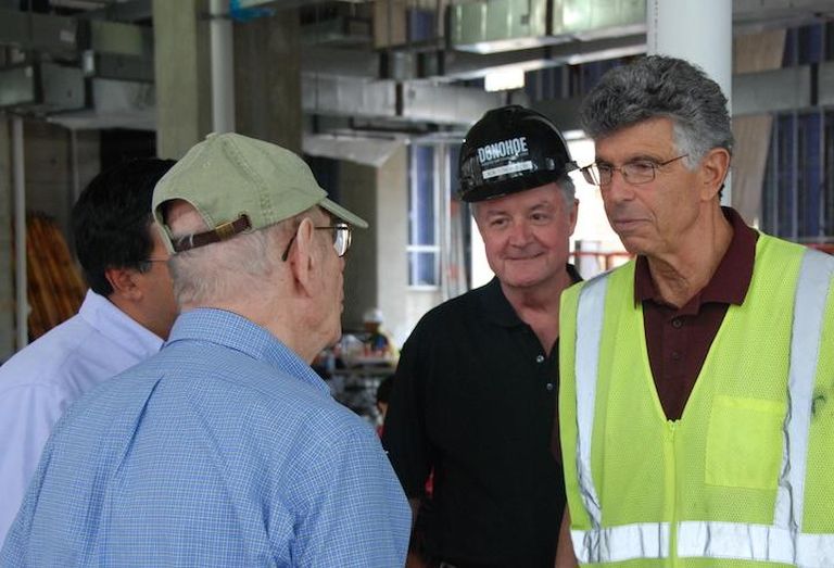 Donohoe Cos. Chairman Robert Donohoe Sr., (center) next to his longtime business partner, Miller & Long's Nick Paleologos, at the Gallery Bethesda topping out ceremony. 