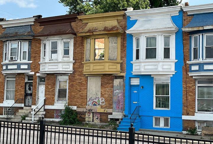 A mix of occupied and vacant homes along West Mulberry Street across from the West Baltimore MARC station.