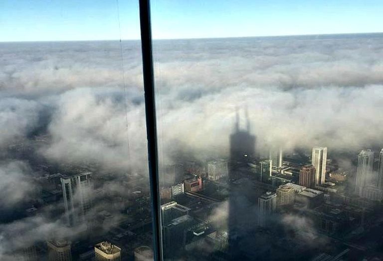 A view of Chicago, obscured by clouds, from Willis Tower's Skydeck.