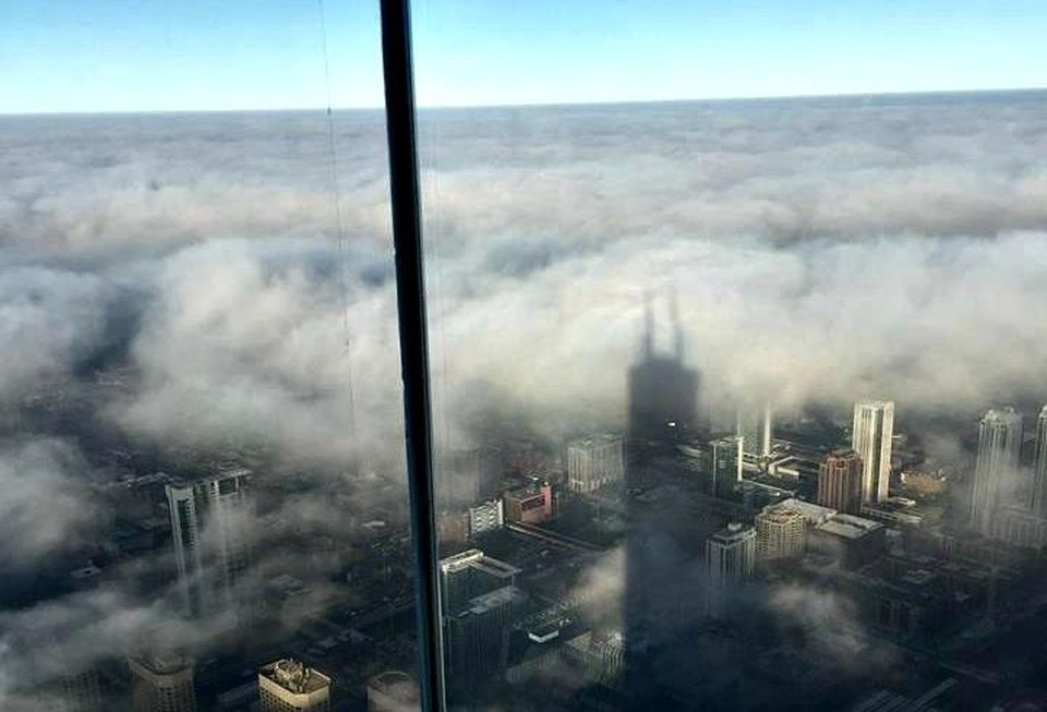 A view of Chicago, obscured by clouds, from Willis Tower's Skydeck.