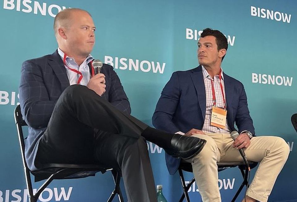 28 Walker Development's Scott Slosson and Greenspring Realty Partners' Dan Flamholz speaking at a September Bisnow event.