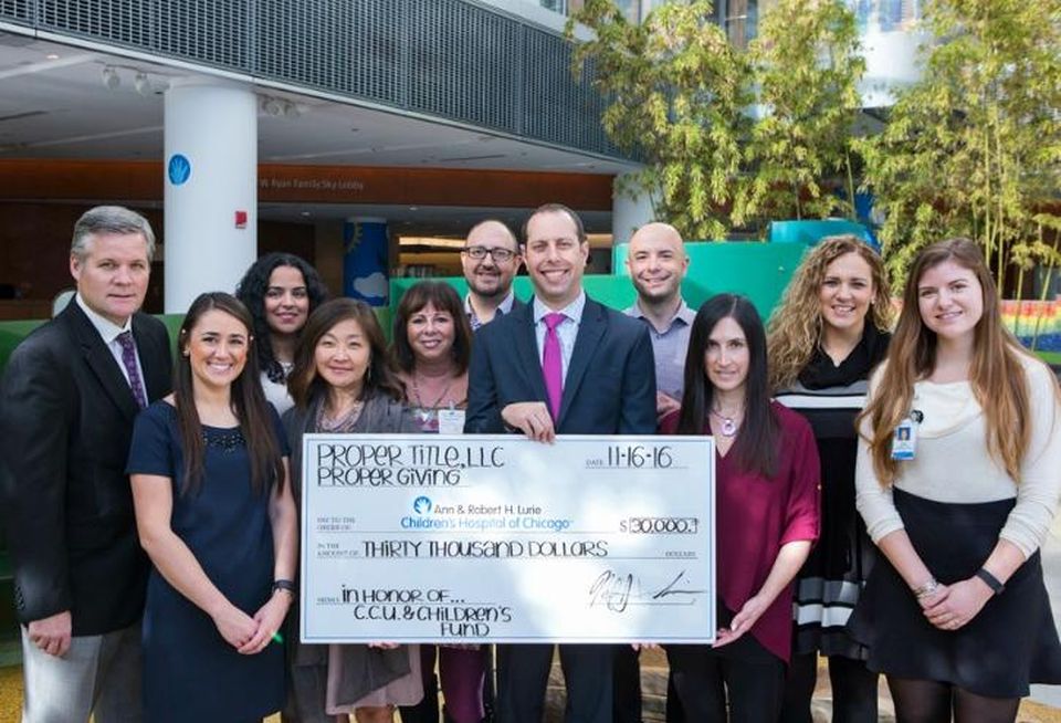 Members of Proper Title, LLC presented representatives of Ann & Robert H. Lurie Children’s Hospital of Chicago with a donation of $30,000 from funds raised through the firm’s charitable arm, Proper Giving.