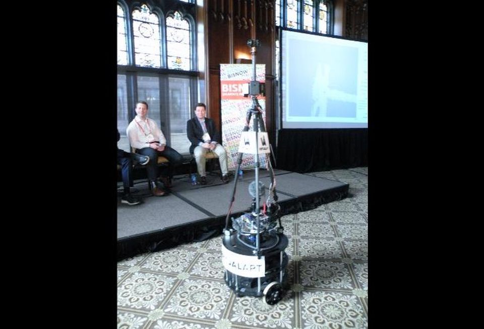 Chicago Ventures principal Ezra Galston and MATH Venture Partners managing director Mark Achler watch a demonstration of VirtualApt