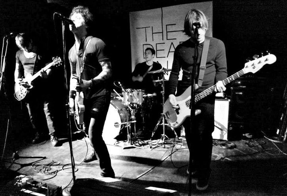 Cushman & Wakefield senior director Loren Guzik plays drum in local band The Dead On