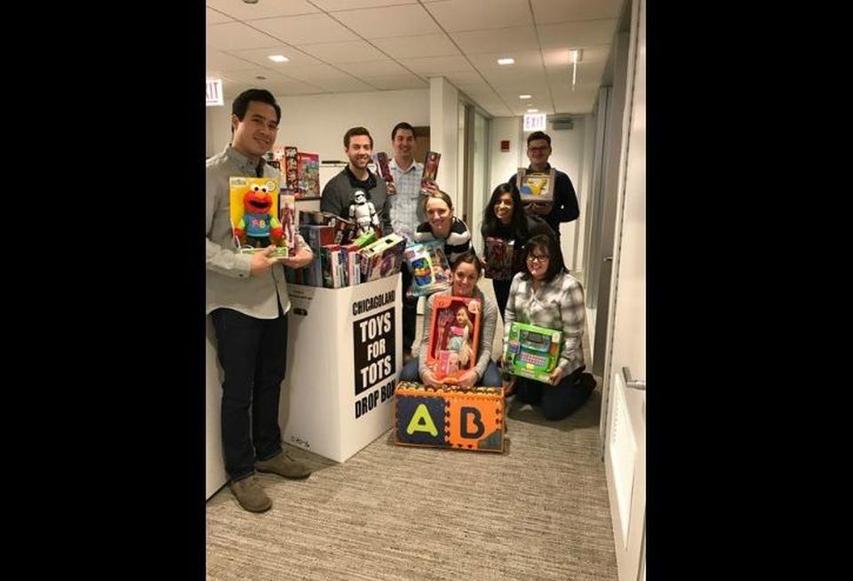 Employees from Draper and Kramer collected more than $4,000 worth of toys for Toys For Tots during the firm’s annual company-wide holiday toy drive.