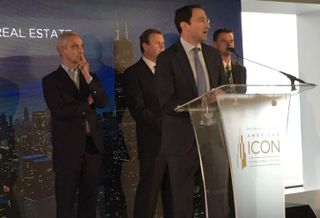 Blackstone Group Global Head Of Real Estate John Gray (at the dais)