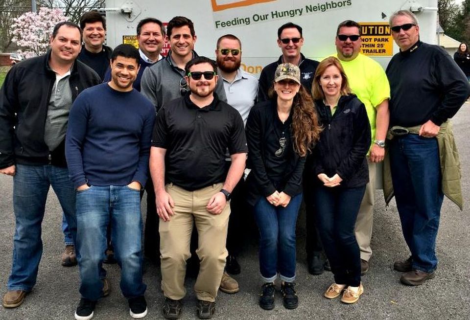 Members of Peak Construction’s PeakGiving team recently joined Northern Illinois Food bank staff and volunteers to distribute food to 128 families in need in suburban Wheaton.
