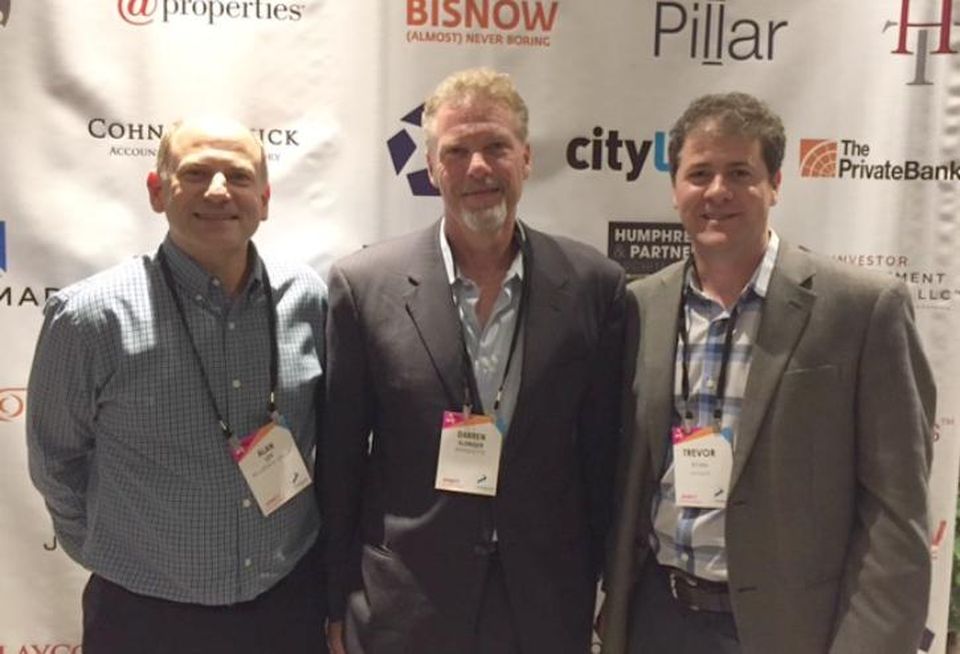 Belgravia Group CEO Alan Lev, Marquette Cos President Darren Sloniger and Marquette Cos EVP Trevor Ryan