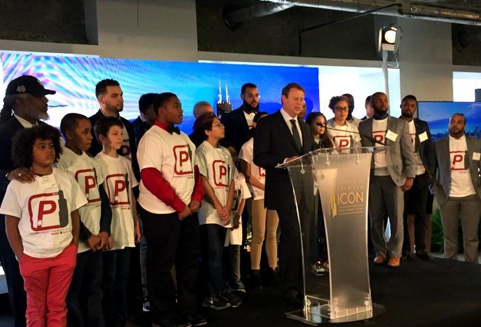 Equity Office president/CEO Eli Khouri (center) flanked by students from Project Pipeline