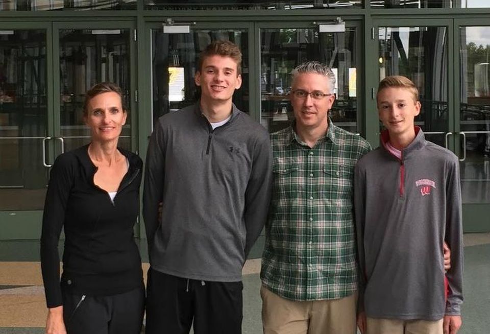 Avison Young Chief Financial Officer Christine Battist with son Alex, husband Robb and son Harrison.