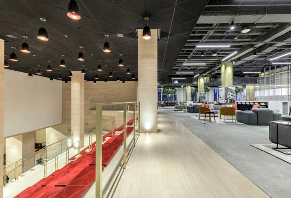The Merchandise Mart's renovated Grand Stair includes a lounge at the top of the staircase and stadium seating along the stairs.