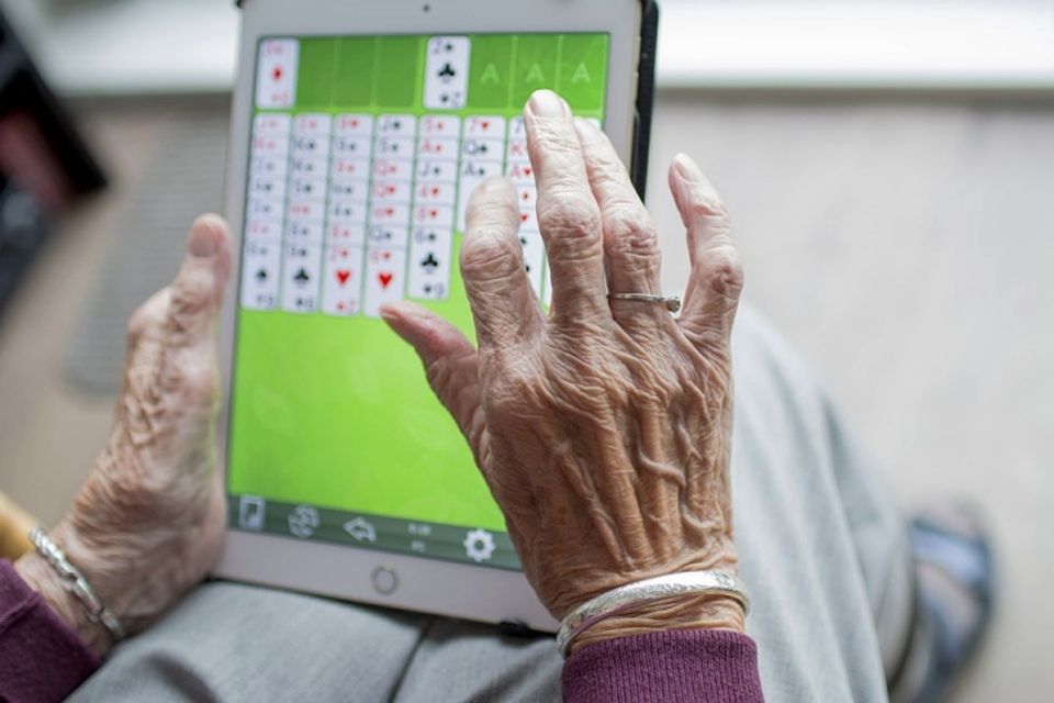 hands and tablet