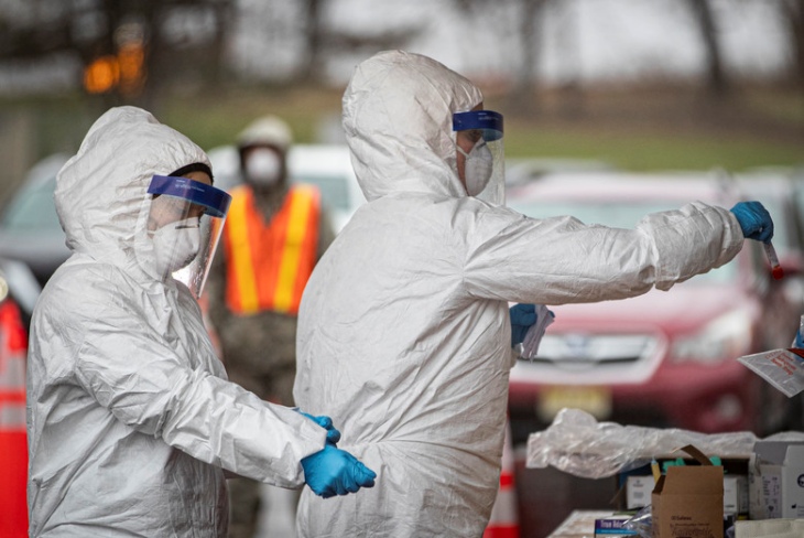 New Jersey Air National Guard medics process specimens at a COVID-19 testing site at the PNC Bank Arts Center in Holmdel, New Jersey.
